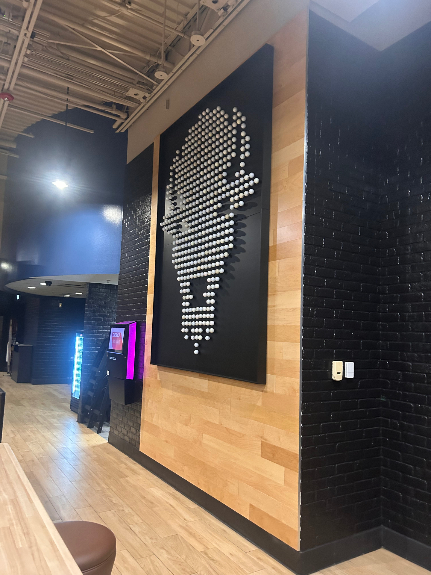 Custom wood accent wall with buffalo art installation